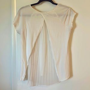 Cream tee with fluttered detail on back